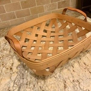 Henn Workshops square woven basket brown leather handles excellent condition.